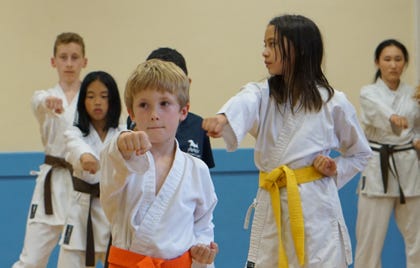 Children listening intently and practicing karate. Karate Marston Karate, focus disciplin 